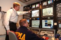 Aaron Skolnik (seated) along with Paul Luke in the FEMA HQ TV Studio during Hurricane Katrina, 2005